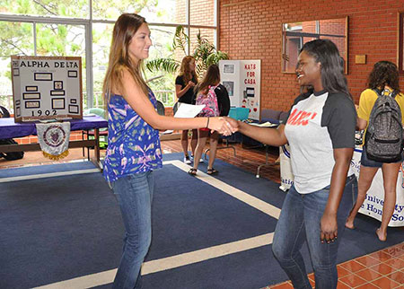 Students at the CJ Org fair
